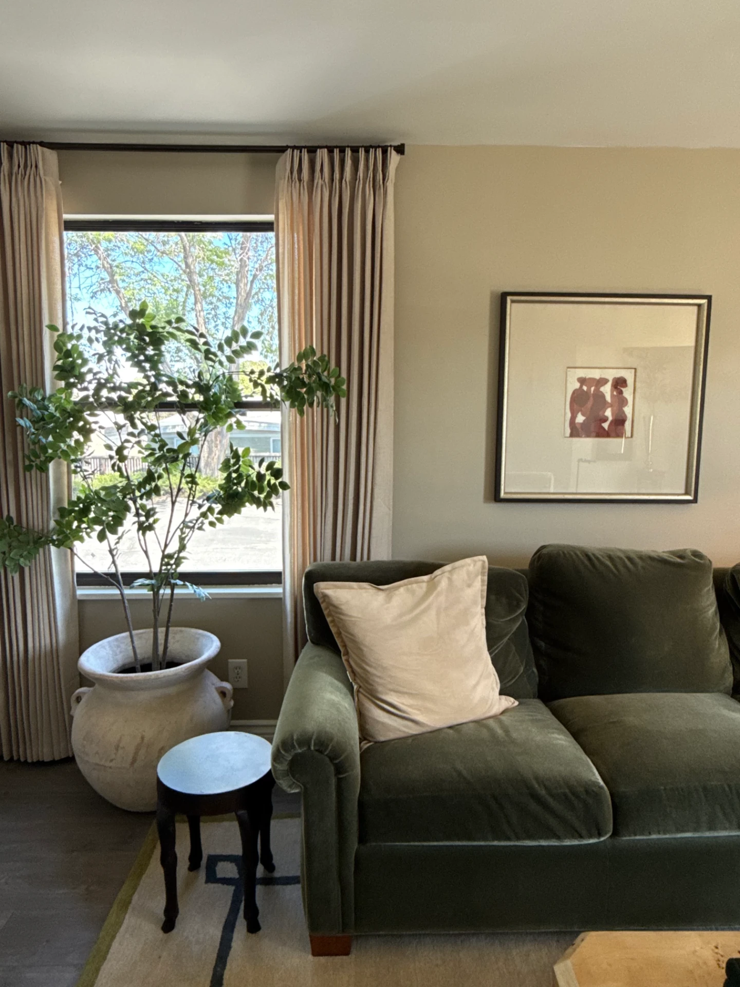 Green sofa beside the window in the BXB Therapy office